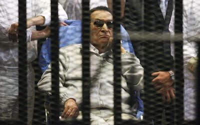 Egypt's ousted President Hosni Mubarak sits inside a dock at the police academy on the outskirts of Cairo, Egypt, in this April 15 2013 file photo.  Picture: REUTERS
