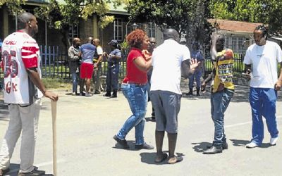 Tensions run high between ANC and SACP members at a police station near to a community hall in Kanyamazane, Mpumalanga, where ANC members disrupted an SACP event. Picture: SETUMO STONE