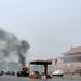 Smoke raises in front of a portrait of late Chinese Chairman Mao Zedong at Tiananmen Square in Beijing on Monday after a car ploughed into pedestrians and caught fire. Picture: REUTERS