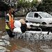 DISASTER: A resident of Somerset West is taken away on a gurney in  November after the area was hit by flash floods. Picture: SUNDAY TIMES