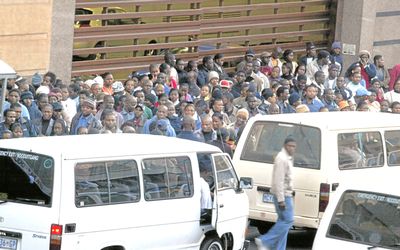 ON THE MOVE: Commuters queue for minibus taxis in Johannesburg. BAW South Africa plans to build the Inyathi minibus in South Africa. Picture: SUNDAY TIMES
