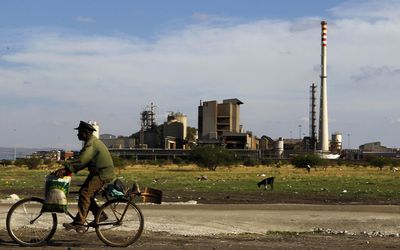 A man rides his bicycle past the Lonmin mine outside Rustenburg, northwest of Johannesburg. Picture: REUTERS