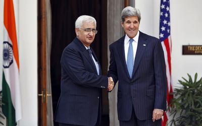 GREEN PARTNERSHIP: US Secretary of State John Kerry, right, shakes hands with Indian Foreign Minister Salman Khurshid before their meeting in New Delhi on Monday. Picture: REUTERS