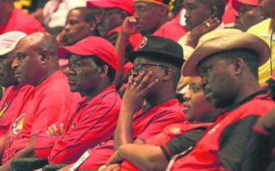 Members of the National Union of Mineworkers listen to proceedings at a hearing into the Marikana massacre last year.  Picture: SOWETAN