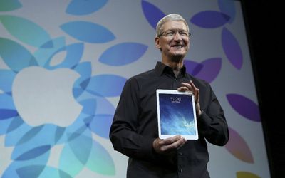 EVOLUTION: Apple CEO Tim Cook holds up the new iPad Air during an Apple event in San Francisco on Tuesday. Picture: REUTERS
