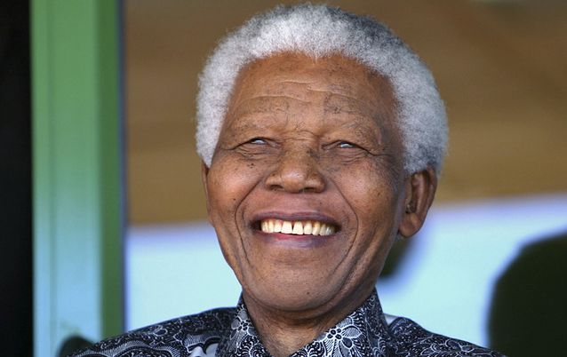 Nelson Mandela smiles as he watches the coronation ceremony of Bafokeng King Leruo Tshekedi Molotlegi in Phokeng, north of Johannesburg, in August 2003. Picture: REUTERS