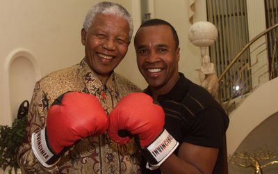 Late former president Nelson Mandela, right, a boxer in his youth, poses with boxer Sugar Ray Leonard. Picture: SUNDAY TIMES