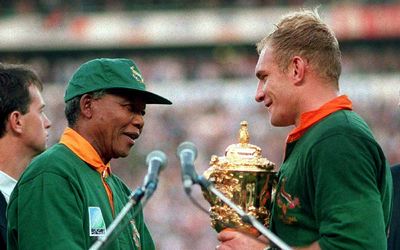 Former President Nelson Mandela (left) presents the William Webb Ellis Cup to Springbok captain Francois Pienaar after his team defeated New Zealand in the Rugby World Cup final played at Ellis Park in Johannesburg, in this June 24 1995 file photo. Picture: REUTERS