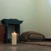 A candle burns on Sunday in Nelson Mandela’s cell on Robben Island, three days after he died in Johannesburg at the age of 95. Picture: TREVOR SAMSON