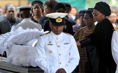 GRIEVING: Former president Nelson Mandela’s widow Graça Machel by her husband’s coffin as he lies in state at the Union Buildings in Pretoria on Wednesday. Picture: GCIS