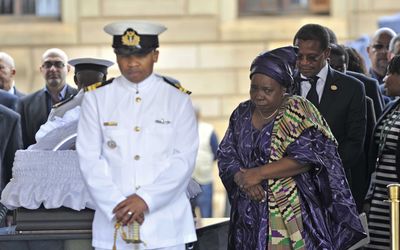 AU Commission chairwoman Nkosazana Dlamini-Zuma, a former South African Cabinet minister, next to the casket of Nelson Mandela at the Union Buildings on Wednesday. Picture: GCIS