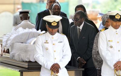 Zimbabwean President Robert Mugabe on Wednesday views the body of Nelson Mandela lying in state at the Union Buildings in Pretoria. Picture: GCIS