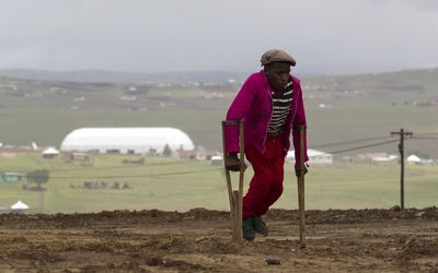 A man walks past the arena on the property of former president Nelson Mandela where his funeral will be held in Qunu on Sunday. Picture: REUTERS 
