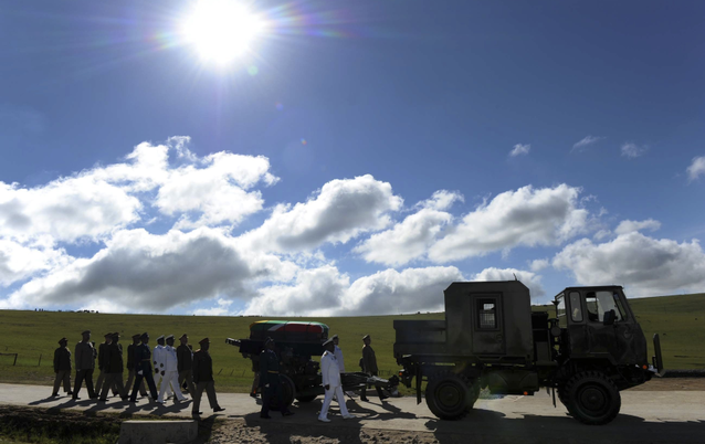Former president Nelson Mandela’s coffin arrives on a gun carriage for his funeral ceremony in Qunu on Sunday. Picture: GCIS