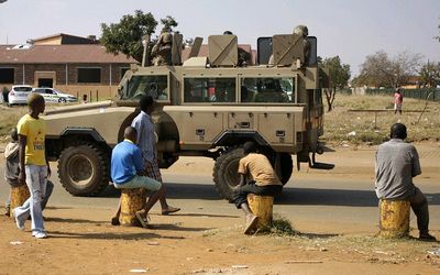 South African National Defence Force soldiers patrol the streets as voting takes place in Bekkersdal on Wednesday.  Picture: PUXLEY MAKGATHO  