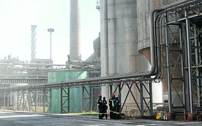 FUTURE: Workers stand beside storage towers at Sappi’s Ngodwana wood mill in Mpumalanga on  Wednesday. Picture: BLOOMBERG