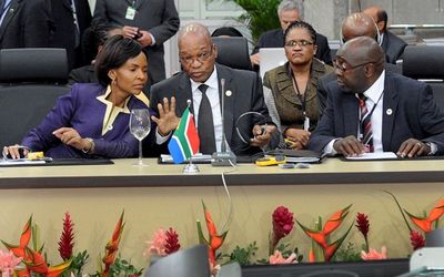 (Front, left to right) Maite Nkoana-Mashabane, President Jacob Zuma and Nhlanhla Nene exhange a few words at a Brics (Brazil Russia, India, China and South Africa) summit in Brazil on Tuesday.  Picture: GCIS