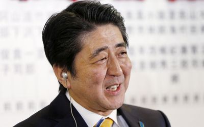 Japan's Prime Minister Shinzo Abe, who is also leader of the ruling Liberal Democratic Party (LDP), reacts during a news conference at the LDP headquarters in Tokyo on Sunday. Picture: REUTERS