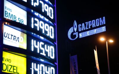 A neon sign displays Gazprom's  logo at a petrol station in Belgrade, Serbia.  Gazprom may be overtaken by top rival Rosneft. Picture: BLOOMBERG/OLIVER BUNIC