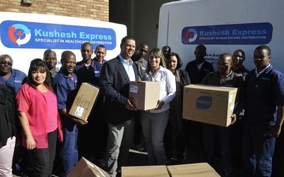 Ashley and Tanya Mulligan surrounded by their staff. The couple and their specialist courier firm do everything they can to earn their customers’ trust. Picture: FREDDY MAVUNDA