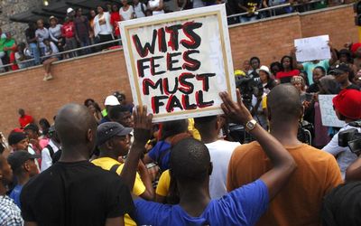 DEMANDS: Wits university students protest outside the Parktown campus over fee hikes. Picture: PUXLEY MAKGATHO
