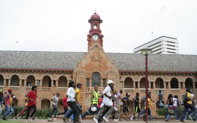 Students run past the Old Arts Building at the University of Pretoria's Hatfield campus. Picture: Aron Hyman