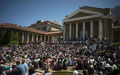 October 22: Thousands of students converge at the University of Cape Town for a meeting about ongoing protests against fee hikes by students from various tertiary education institutions around the city. Picture: AFP/ RODGER BOSCH