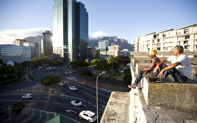 Cape Town residents Dorothy Pieterson and Hilton Esau watch the sunrise from a bridge in Cape Town’s central business district.  Picture: THE TIMES