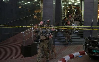 French soldiers leave the Radisson hotel in Bamako, Mali, on Friday. Picture: REUTERS