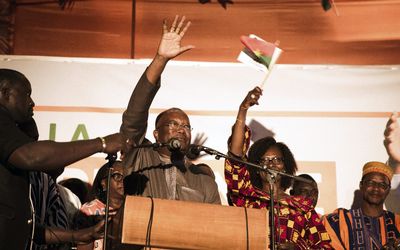 Roch Marc Christian Kabore, centre, of the People's Movement for Progress, waves to supporters as he accepts victory in the general elections in Ouagadougou, Burkina Faso, on Tuesday, 1 December 2015. Picture: EPA