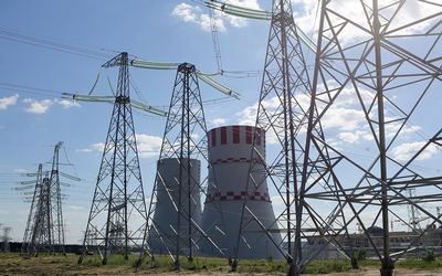 Pylons carry electricity power lines past cooling towers at the Novovoronezh NPP-2 nuclear power station, operated by OAO Rosenergoatom, a unit of Rosatom, in Novovoronezh, Russia. Picture: BLOOMBERG