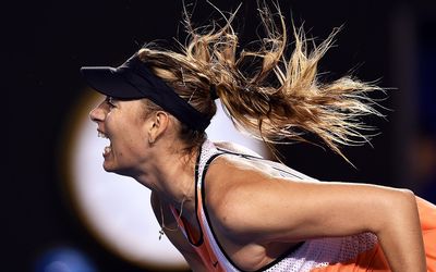 Maria Sharapova of Russia serves against Belinda Bencic of Switzerland during their fourth round match at the Australian Open tennis tournament in Melbourne, Australia, on Sunday. Picture: EPA/TRACEY NEARMY