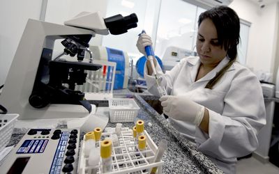 A technician analyses blood samples. The clinic in Rio de Janeiro searches for dengue, Zika and chicungunya viruses in blood, a process that takes 30 minutes. Picture: AFP PHOTO/VANDERLEI ALMEIDA