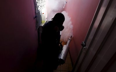 A municipal health worker fumigates a home in Tegucigalpa, Honduras, as part of the city’s effort to prevent the spread of the Zika virus’s vector, the Aedes aegypti mosquito. Latin America has been widely hit. Picture: REUTERS/JORGE CABRERA