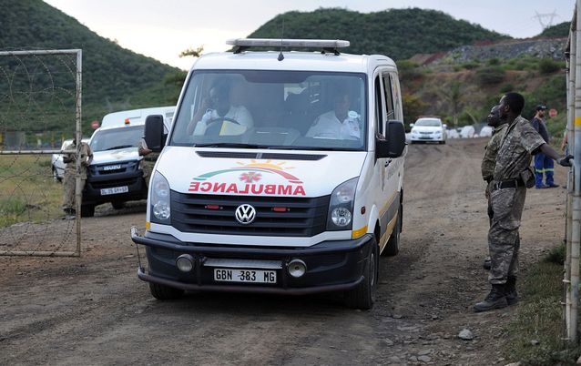 Security marshalls open the gates for an ambulance to leave the Goldfields Lily Mine in Barberton in the South African Mpumalanga province after a gold mine collapsed earlier this month. Picture: AFP/STRINGER