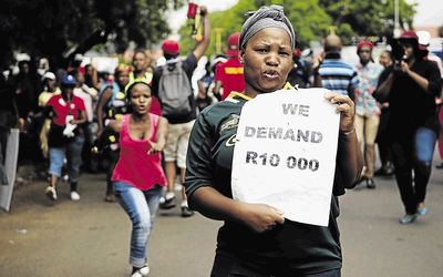 A contract worker at Tshwane University of Technology protests against outsourcing. Picture: SOWETAN