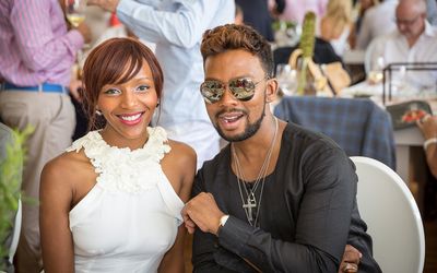 Metro FM DJ Nandi Ganda and fashion designer David Tlale attended the 2016 AfriAsia Bank Cape Wine Auction, which raised R15-million for education in the Cape Winelands. Picture: SUPPLIED