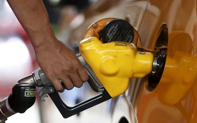 A worker at state-owned Pertamina, the country's main retailer of subsidised fuel, fills a vehicle at a petrol station in Jakarta. Picture: REUTERS