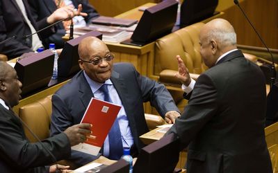 Finance Minister Pravin Gordhan, right, greets President Jacob Zuma, centre, and Deputy President Cyril Ramaphosa shortly before delivering the budget speech in Parliament on Wednesday.  Picture: TREVOR SAMSON