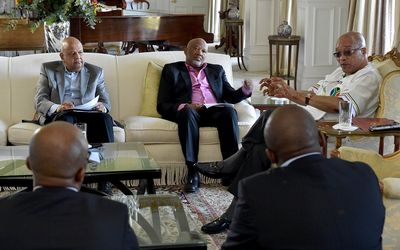 President Jacob Zuma, far right, meets with Finance Minister Pravin Gordhan (left), Deputy Finance Minister Mcebisi Jonas (centre) and Treasury director-general Lungisa Fuzile (not pictured) to discuss the final touches to the budget 2016 at Genadendal in Cape Town on Tuesday.  Picture: GCIS