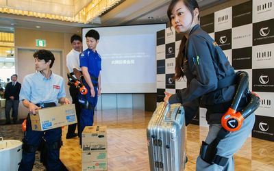 Japan Airport Terminal  workers  wear the Hybrid Assistive Limb exoskeleton robot suit developed by Cyberdyne. The suits will be used at first for  cleaning and carrying tasks at the airport.    Picture: BLOOMBERG
