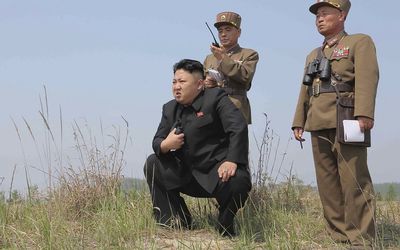 North Korean leader Kim Jong Un (centre) guides the multiple-rocket launching drill of women's sub-units under KPA Unit 851, in this undated file photo released by North Korea's Korean Central News Agency.   Picture: REUTERS 