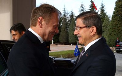 DIPLOMACY:  Turkish Prime Minister Ahmet Davutoglu, right, welcomes EU President Donald Tusk before their meeting in Ankara, Turkey, last week. Turkey is the launch pad for most of the more than 1-million refugees and migrants who have come to the continent. Picture: EPA