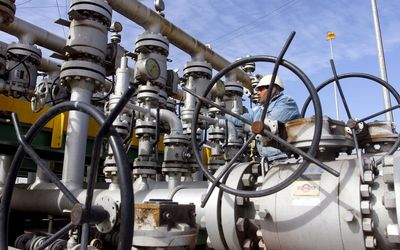 OIL’S NOT WELL:  A worker checks the valves at Al-Sheiba oil refinery in the Iraq city of Basra. Picture: REUTERS/ESSAM AL-SUDANI