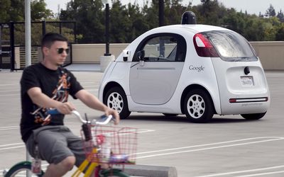 UP TO SPEED: A Google employee on a bicycle acts as a real-life obstacle for a Google self-driving prototype car to react to during a media preview of Google’s prototype autonomous vehicles in Mountain View, California, last year. Picture: REUTERS/ELIJAH NOUVELAGE