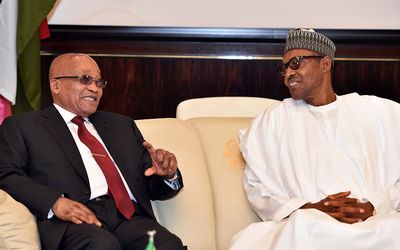 President Jacob Zuma, left, speaks to Nigerian President Muhammadu Buhari during a visit to Nigeria on Tuesday.  Picture: GCIS
