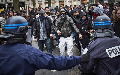 Police face angry demonstrators in Lyon, France on Wednesday, during countrywide protests against deeply unpopular  unpopular proposed labour reforms that have raised hackles in a country accustomed to iron-clad job security. Picture: AFP PHOTO/JEAN-PHILIPPE KSIAZEK 