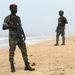 HIGH ALERT: Ivorian soldiers patrol the beach in Grand Bassam, Cote d’Ivoire after an attack at the weekend that killed 18 people. Picture: REUTERS