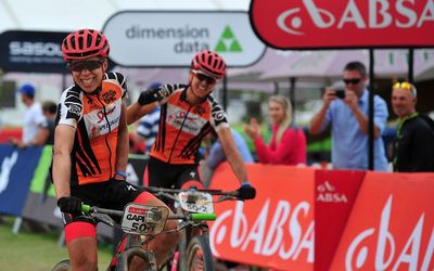 DELIGHTED:  Annika Langvad, left, and teammate Ariane Kleinhans cross the line first  at yesterday’s stage 4 of the Absa Cape Epic. Picture: CHRIS RICCO/BACKPAGEPIX