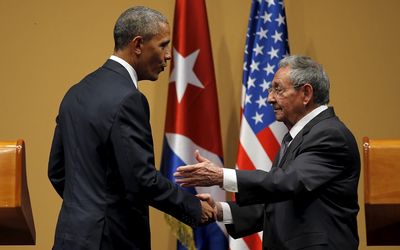 US President Barack Obama shakes hands with Cuban President Raul Castro after a heated news conference in Havana, Cuba, on Monday. Picture: REUTERS/CARLOS BARRIA